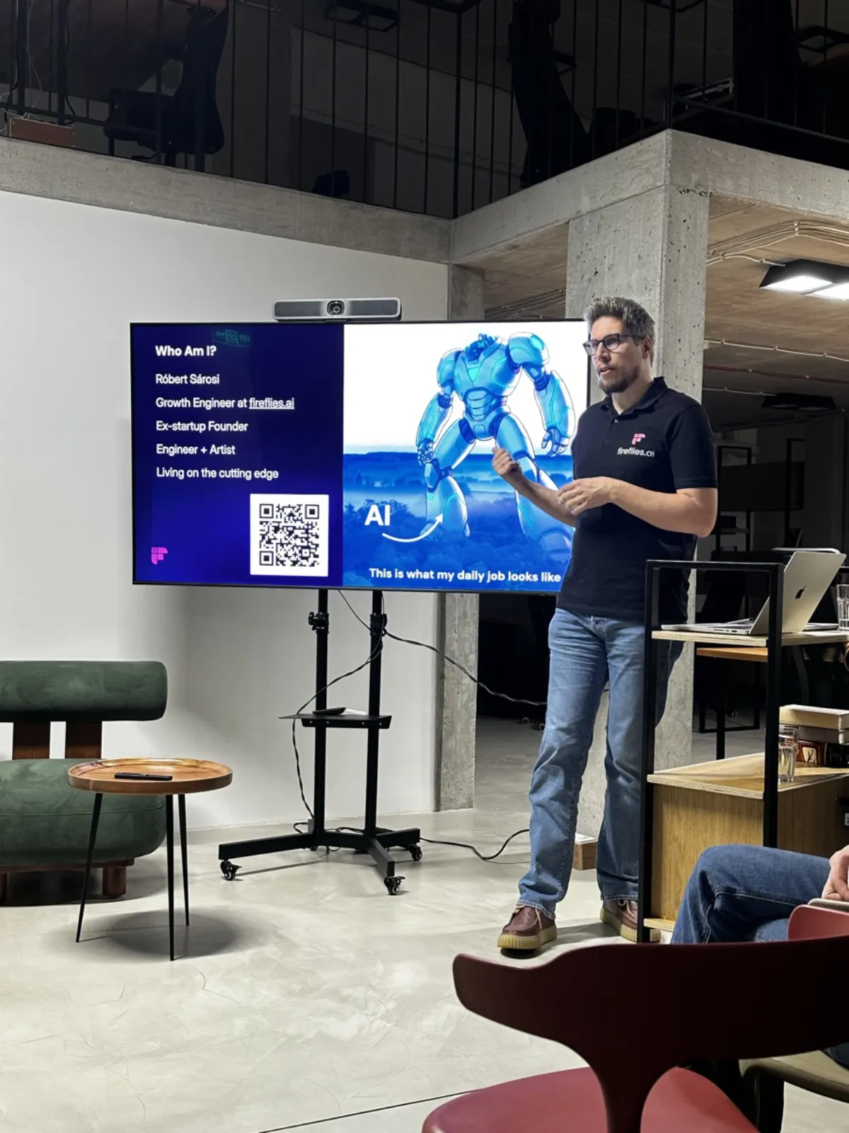 Robert Sárosi presenting his intro slide at the first Budapest Agentics Foundation meetup, wearing a Fireflies.ai polo shirt